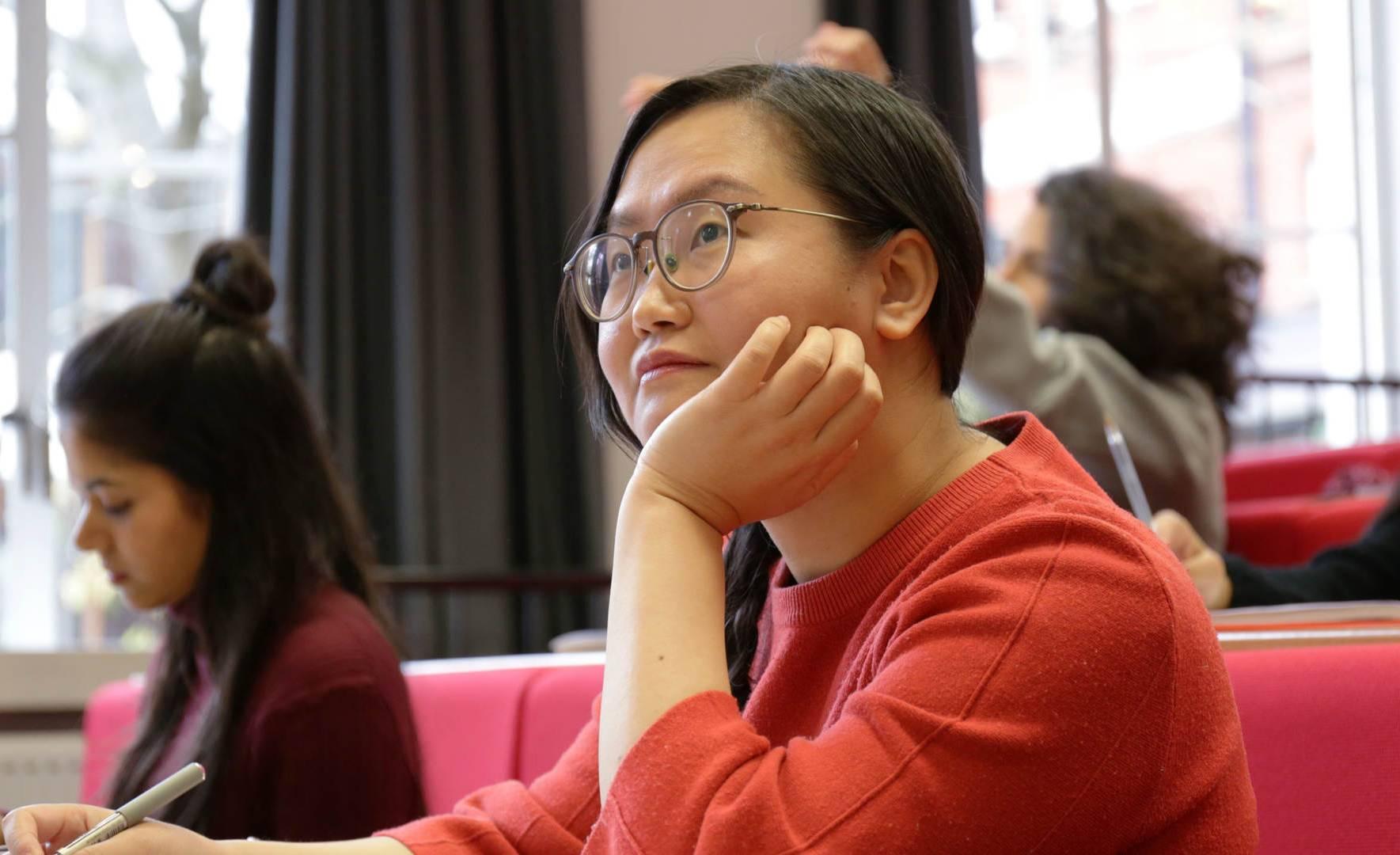 A student listens attentively in a lecture 